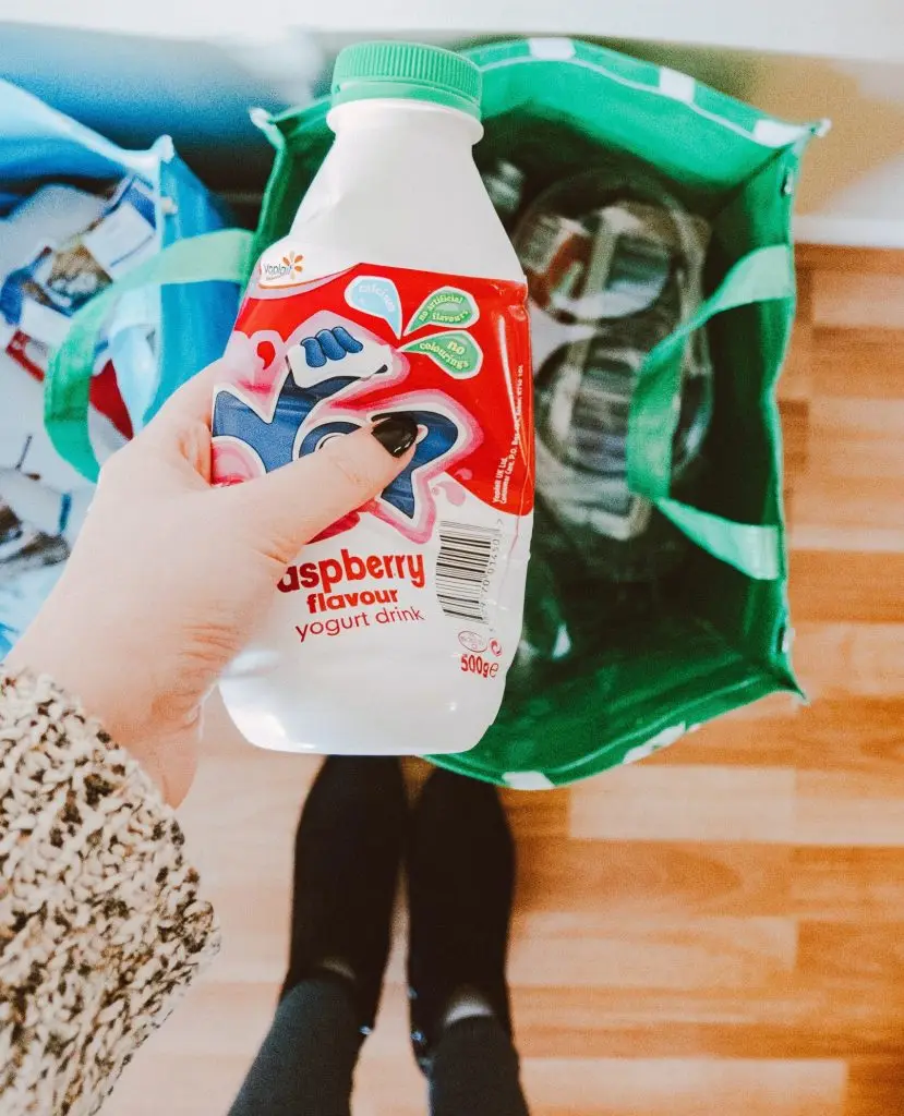 Woman in house share recycling 
